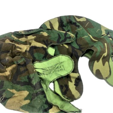 An M-1 Helmet Cover, Transitional Pattern used condition dated 1976