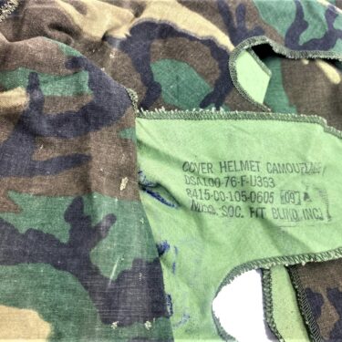 An M-1 Helmet Cover, Transitional Pattern used condition 1976 dated