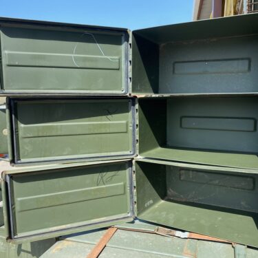 50 cal ammo cans stacked on pallets