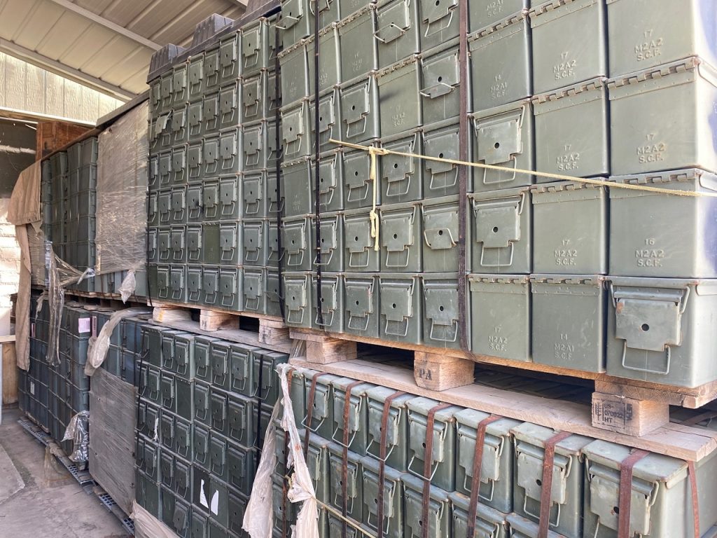 50 cal ammo cans stacked on pallets