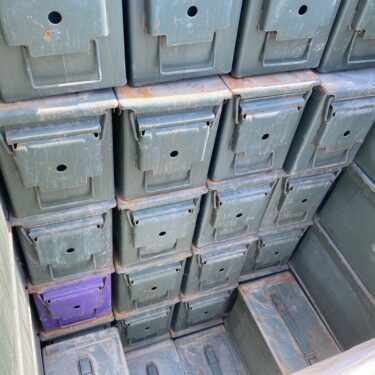 50 cal ammo cans stacked on pallets