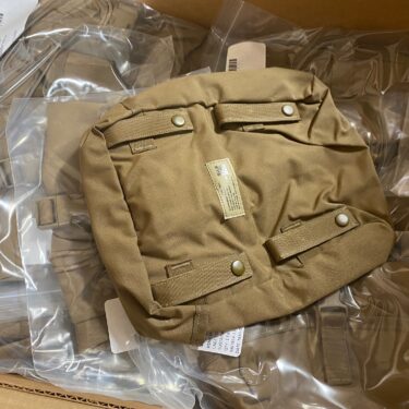 genuine military surplus USMC Molle Sustainment Pouch, Coyote Brown. Stack of pouches in original government cases.