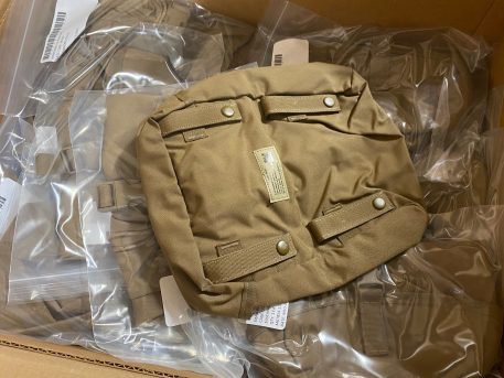 genuine military surplus USMC Molle Sustainment Pouch, Coyote Brown. Stack of pouches in original government cases.
